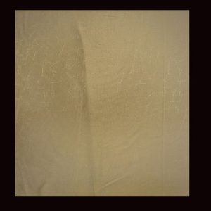 Luxurious deep gold fabric with light gold imprint