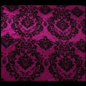 Vibrant pink tafetta fabric with black embossed print