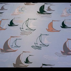 Polyhester powder blue fabric with grey, green and orange boats (Perfect for kids)